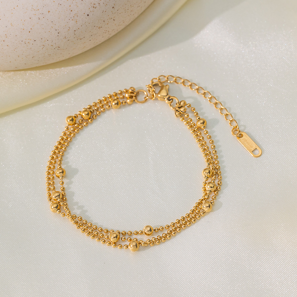 Brazalete Triple de Bolitas Doradas