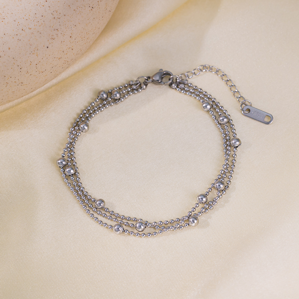 Brazalete Triple de Bolitas Plateadas