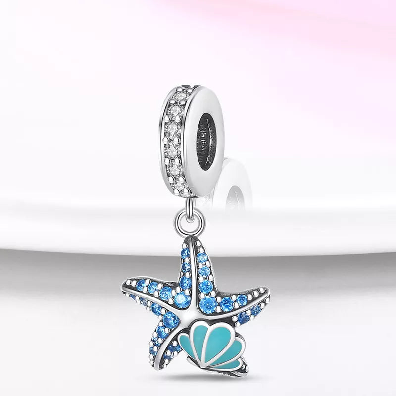 Charm Estrella de Mar y Concha Fluorescentes