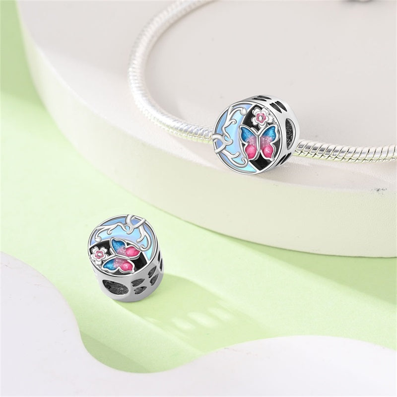 Charm Luna Azul y Mariposa Rosa