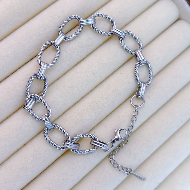 Brazalete Plateado Eslabones Trenzados