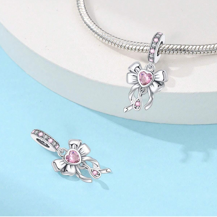 Charm Moño y Corazón Rosa