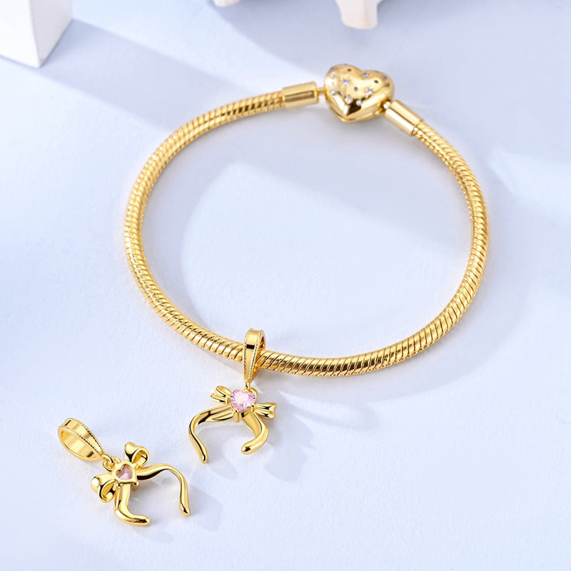 Charm Moño Dorado