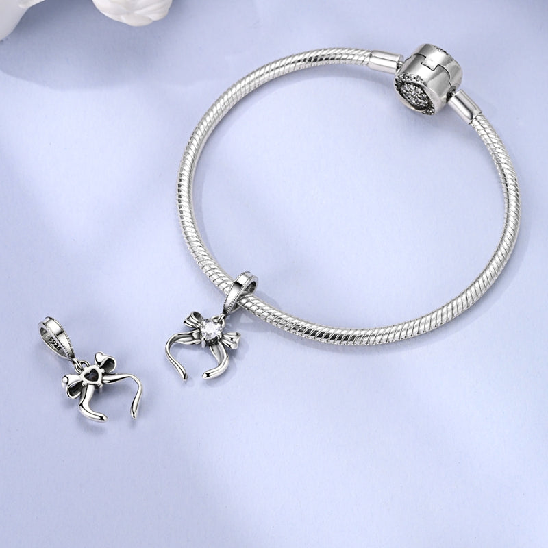 Charm Moño Plateado
