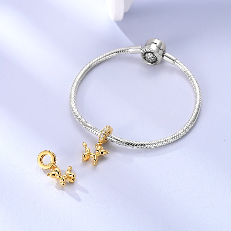 Charm Globo Dorado