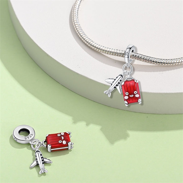 Charm Avion y Maleta Roja