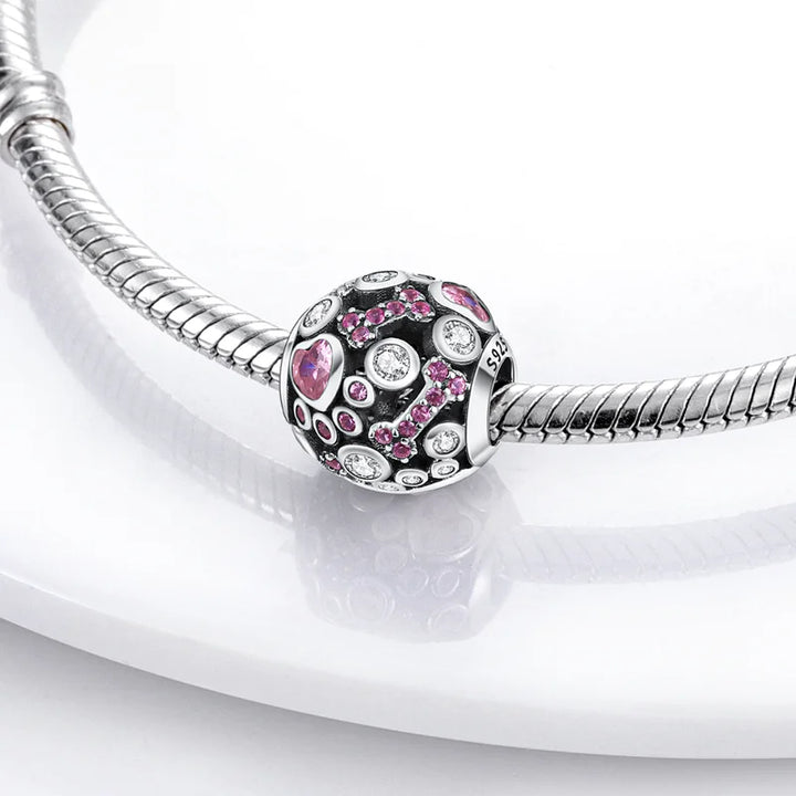Charm Esfera de Huesos y Huellas Diamantado