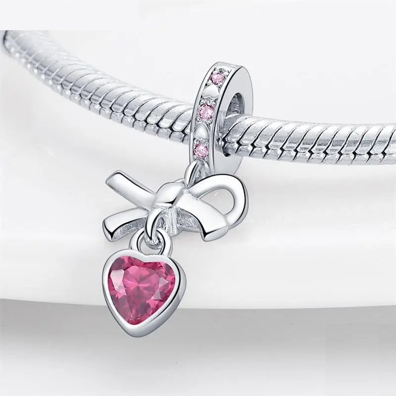 Charm Moño de Corazon Rosa